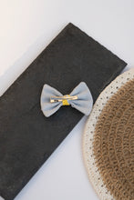 Load image into Gallery viewer, A Cotton Bow Hair Clip kids hair accessories kept on a black surface
