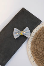 Load image into Gallery viewer, A Cotton Bow Hair Clip kids hair accessories kept on a black surface