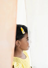 Load image into Gallery viewer, A beautiful image of child, partly visible between curtains who is wearing Embroidery Tic Tac Hair Clips as hair accessories