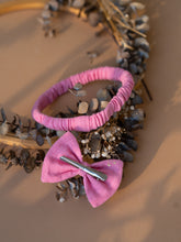 Load image into Gallery viewer, Beautiful baby hair accessories of headband with bow clip kept upon a dried leaf.
