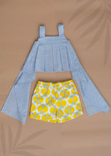 गैलरी व्यूवर में इमेज लोड करें, A set of Pure Cotton Pleated Top and Shorts for baby girl dresses kept on a beige colored background