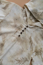 Load image into Gallery viewer, A unisex hooded kurta eco-printed using silver oak leaves kept upon a peach background.