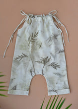 गैलरी व्यूवर में इमेज लोड करें, An organic cotton jumpsuit eco-printed with silver oak leaves with some leaves aside.