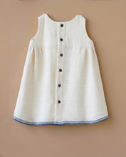 गैलरी व्यूवर में इमेज लोड करें, A backside of an elegant Vintage kora white frock kept upon a peach background.