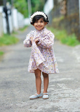 गैलरी व्यूवर में इमेज लोड करें, A kid wearing dreamy fairy lavender baby girl dress with a white head band and posing in between the street.