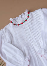 Load image into Gallery viewer, Beautiful white dress with pintuck detailing across the bust and ruffles running across the neckline with a leaf aside.