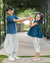 गैलरी व्यूवर में इमेज लोड करें, A young girl wearing elegant blue flutter sleeve top and cream balloon pant and young boy wearing blue and cream balloon pant posing together.