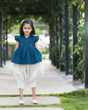 गैलरी व्यूवर में इमेज लोड करें, A young girl posing by wearing elegant blue flutter sleeve top and cream balloon pant with blur background