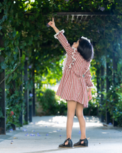 गैलरी व्यूवर में इमेज लोड करें, A girl wearing beautiful lace shift dress with matching accessory pointing her hand towards sky and posing in the middle of the road.