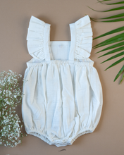 Load image into Gallery viewer, The back side of romper with some flower embroidery on it with some leaf and flower aside.