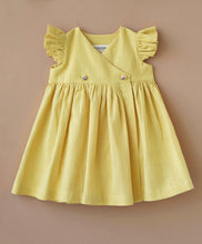 Load image into Gallery viewer, A designer yellow flutter sleeve wrap dress kept upon a light peach background.