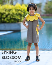 Load image into Gallery viewer, A girl posing ahead of swimming pool wearing a beautiful dress with petal detailing&#39;s around the neck and pockets.
