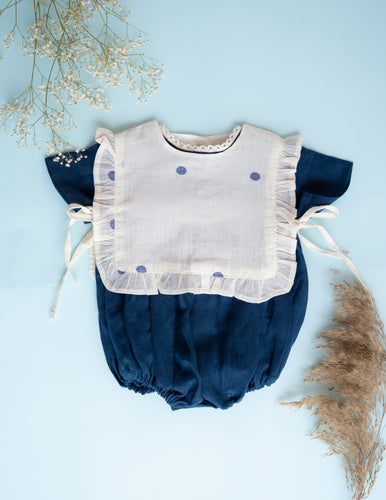 A beautiful image of Baby Girl Romper and Detachable Vest | Cotton | Indigo against a blue surface 