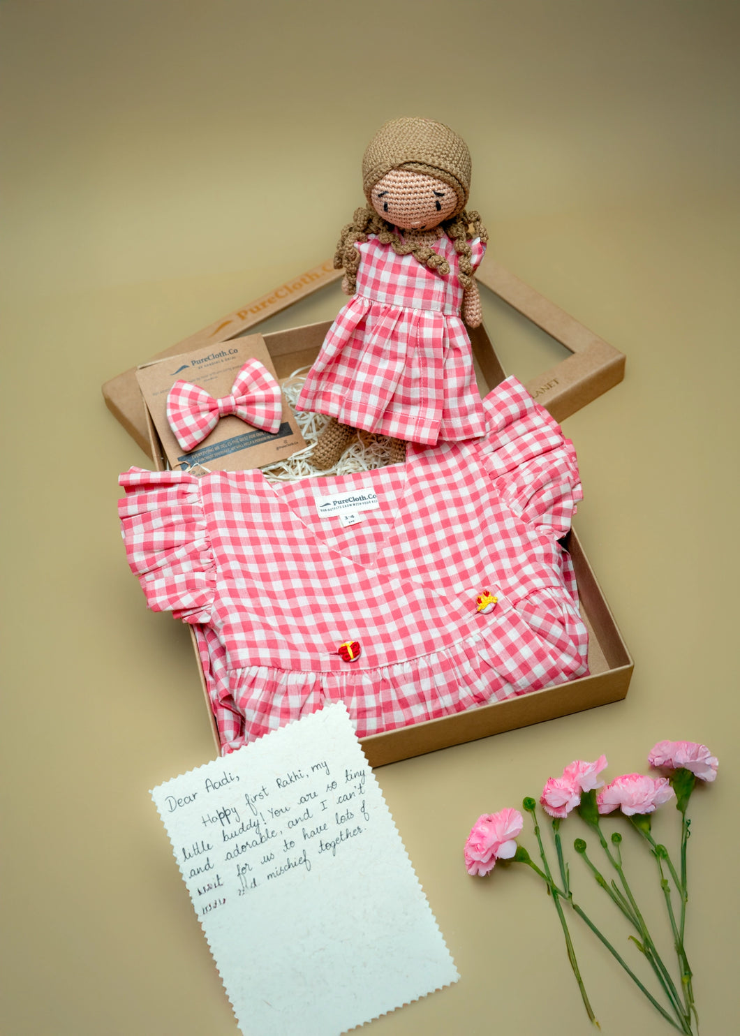 Blush Check Belle Rakhi Gift Hamper for Sister - Wrap Dress & Handmade Doll