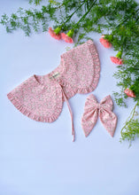 Load image into Gallery viewer, A beautiful pink floral combo of detachable victorian style collar and matching bow with small frills around it for kids kept on light blue background with some flowers aside.
