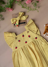 Load image into Gallery viewer, A yellow baby girl dress with head band and cute little deer-friend is kept on a baby pink background with some flowers aside.
