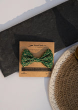 Load image into Gallery viewer, A beautiful Green Silk Hair Clip for hair accessories with branding of PureCloth.Co Placed on a white and black background 
