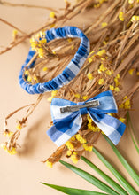 Load image into Gallery viewer, A beautiful cotton handmade blue headbanded and a bow for kidswear kept upon dried flowers.
