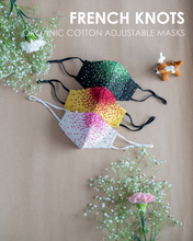 गैलरी व्यूवर में इमेज लोड करें, A colourful French knots organic cotton adjustable masks with some toy and flower aside.
