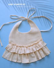 Load image into Gallery viewer, A beautiful cream flare bib kept on a blue background.
