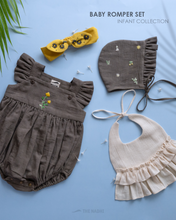 Load image into Gallery viewer, It is an organic baby romper set which has four pieces in total kept upon a blue background with some leaf aside.
