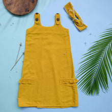 Load image into Gallery viewer, A beautiful deep yellow extendable shift dress with matching hair accessory with wooden, two bi needles and leaf aside.
