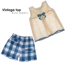 Load image into Gallery viewer, A beautiful white front inverted pleat and tiny handcrafted French knots running across shoulders with the classic blue checkered short.
